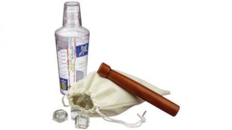 3 PIECE COCKTAIL SET â€“  Plastic cocktail shaker including measure, canvas ice pack and wooden ice 